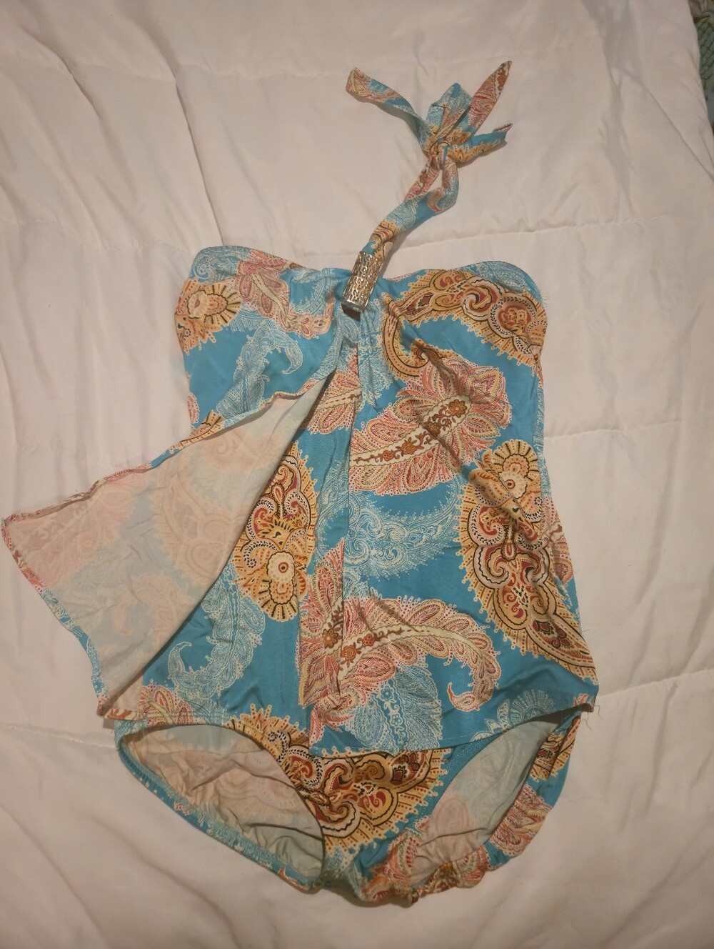 Tara Grinna One-piece halter swimsuits in teal.